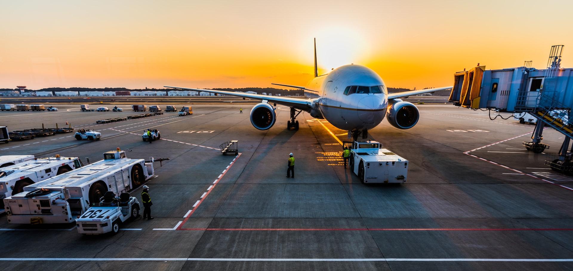 gray airplane on parking